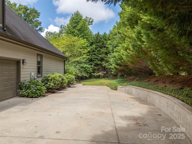 60 Bridge Ln, Tryon, NC 28782 - view of patio / terrace with concrete driveway and a garage