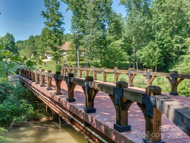 60 Bridge Ln, Tryon, NC 28782 - dock area featuring view of wooded area