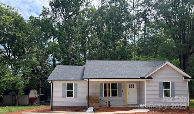234 W Vance St, China Grove, NC 28023 - view of front of house with covered porch and roof with shingles