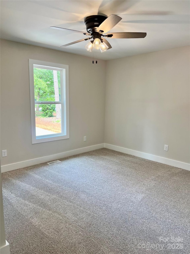 234 W Vance St, China Grove, NC 28023 - carpeted empty room with a ceiling fan and baseboards