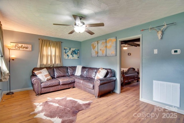 1715 Nelson Dr, Newton, NC 28658 - living room with ceiling fan and wood finished floors