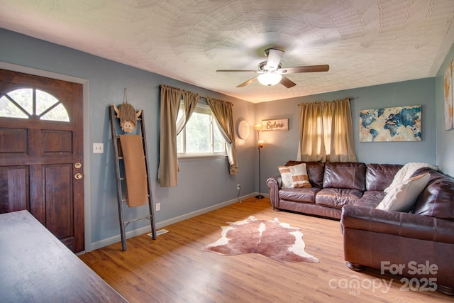 1715 Nelson Dr, Newton, NC 28658 - living area with a ceiling fan and wood finished floors