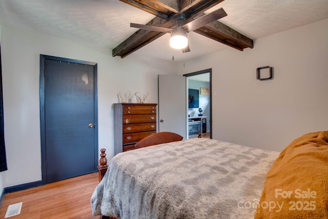 1715 Nelson Dr, Newton, NC 28658 - bedroom featuring light wood-style floors, beamed ceiling, and ceiling fan
