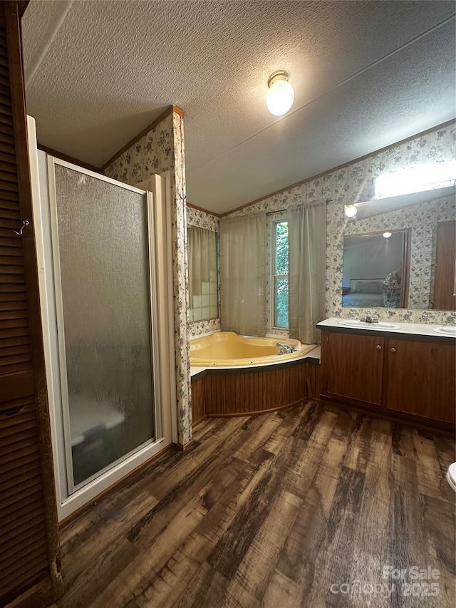 584 Ebenezer Rd, Old Fort, NC 28762 - bathroom featuring wallpapered walls, wood finished floors, vanity, a bath, and a shower stall
