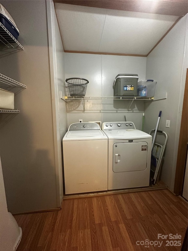584 Ebenezer Rd, Old Fort, NC 28762 - laundry area with wood finished floors and independent washer and dryer