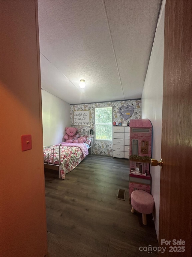 584 Ebenezer Rd, Old Fort, NC 28762 - bedroom featuring wood finished floors and a textured ceiling