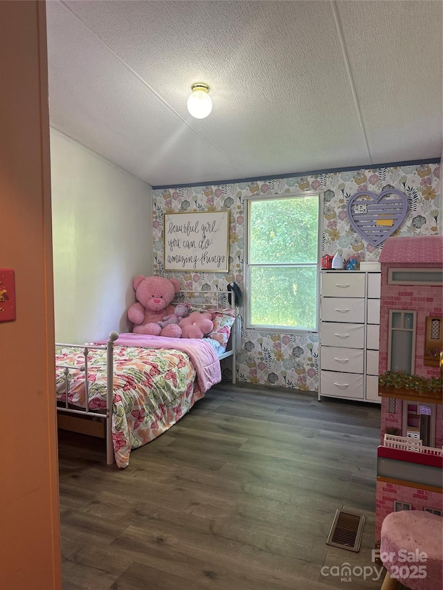 584 Ebenezer Rd, Old Fort, NC 28762 - bedroom featuring wood finished floors and wallpapered walls