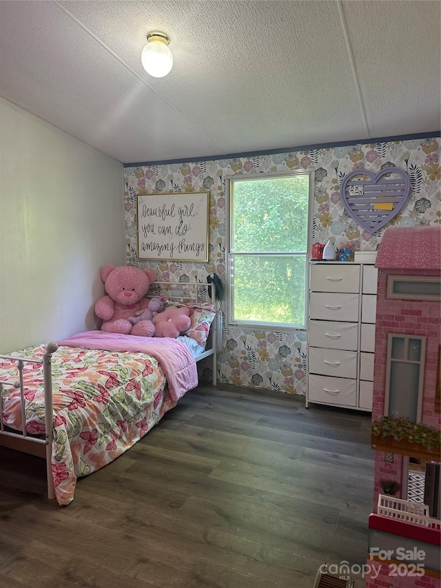 584 Ebenezer Rd, Old Fort, NC 28762 - bedroom with wood finished floors and wallpapered walls