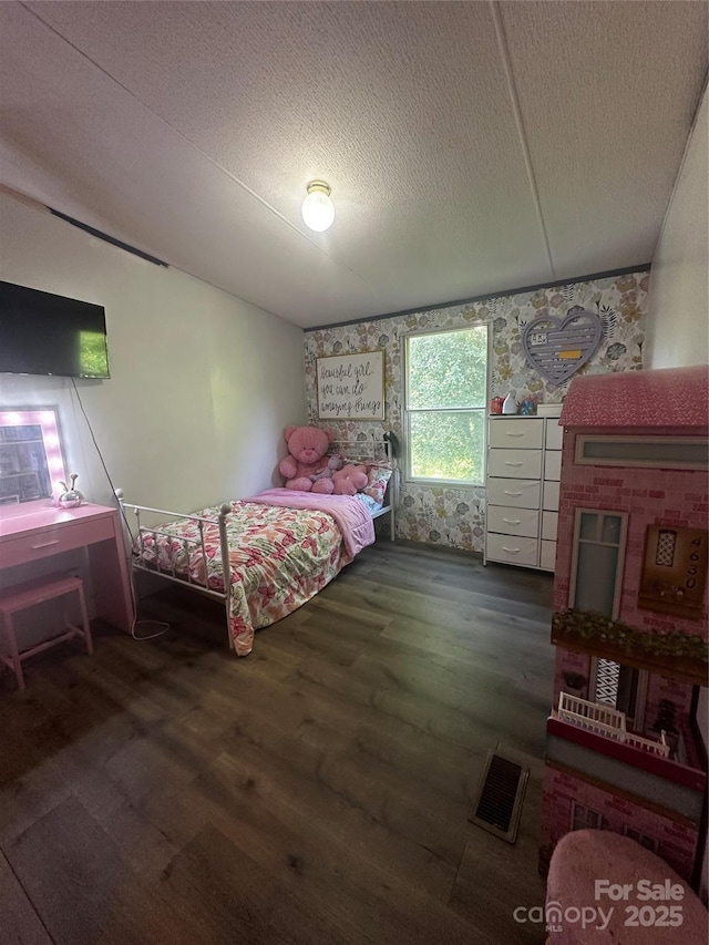 584 Ebenezer Rd, Old Fort, NC 28762 - bedroom with wood finished floors, a textured ceiling, and wallpapered walls