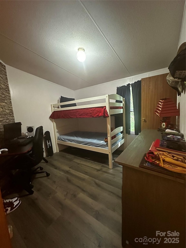 584 Ebenezer Rd, Old Fort, NC 28762 - bedroom with wood finished floors and a textured ceiling