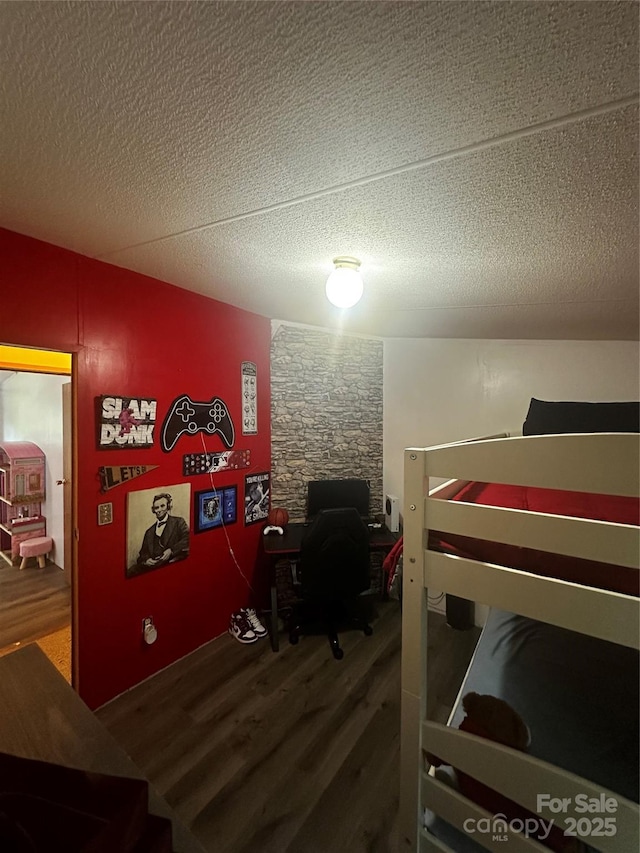 584 Ebenezer Rd, Old Fort, NC 28762 - bedroom featuring wood finished floors and a textured ceiling