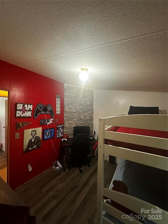 584 Ebenezer Rd, Old Fort, NC 28762 - bedroom with wood finished floors, a textured ceiling, and an office area