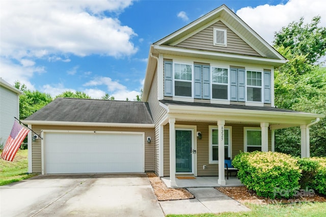 8225 Midas Ln, Locust, NC 28097 - view of front of home with covered porch, a garage, and driveway