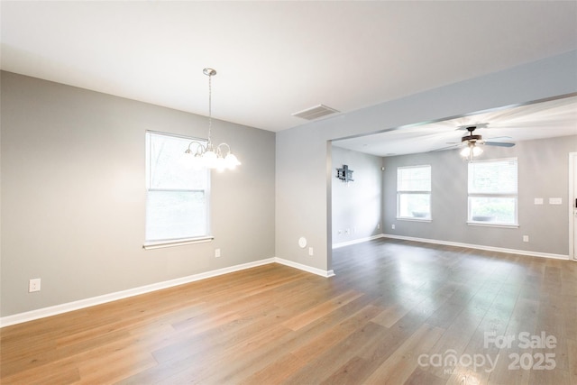 8225 Midas Ln, Locust, NC 28097 - spare room with a chandelier, wood finished floors, and a ceiling fan