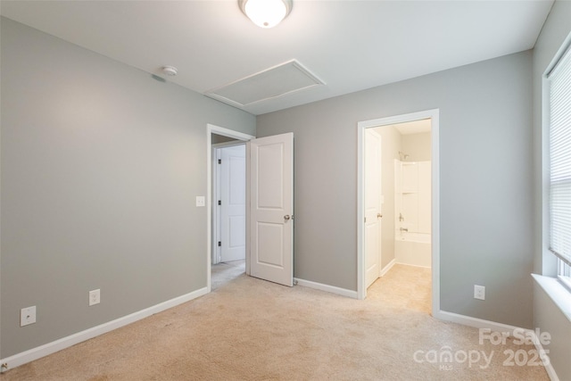 8225 Midas Ln, Locust, NC 28097 - unfurnished bedroom featuring light colored carpet, attic access, and ensuite bath