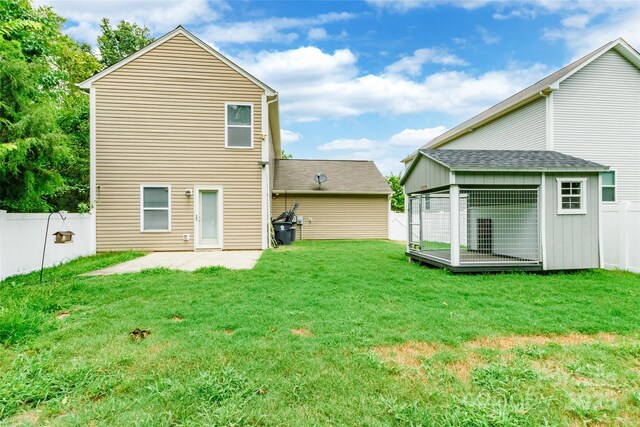 8225 Midas Ln, Locust, NC 28097 - back of property with a fenced backyard, a patio area, and an outbuilding