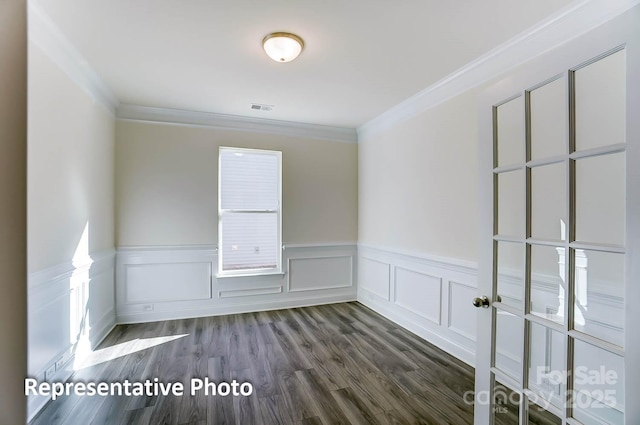 3238 Bozeman Ct Unit 07, Denver, NC 28164 - empty room with ornamental molding, a wainscoted wall, dark wood-style flooring, and a decorative wall
