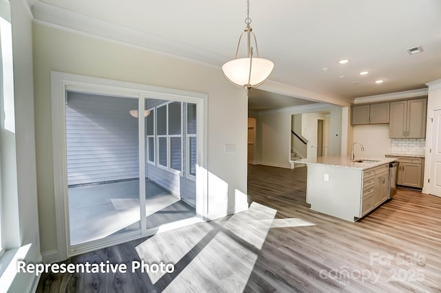 3238 Bozeman Ct Unit 07, Denver, NC 28164 - kitchen with crown molding, light wood-style floors, stainless steel dishwasher, tasteful backsplash, and light stone counters