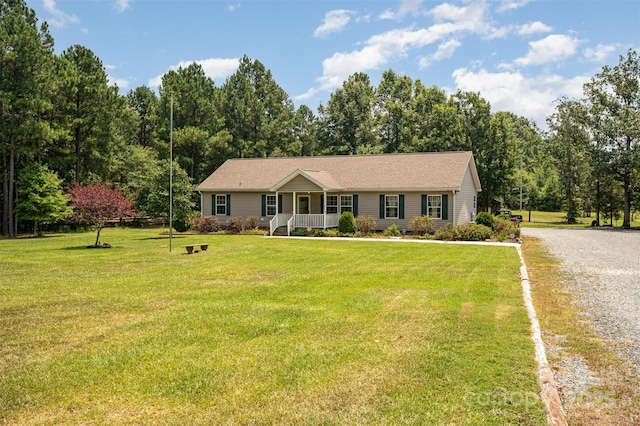 5602 Flint Ridge Church Rd, Marshville, NC 28103 - ranch-style house with a porch, gravel driveway, and a front yard