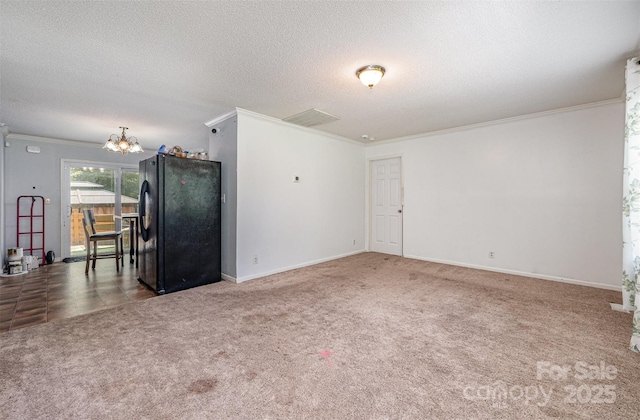 5602 Flint Ridge Church Rd, Marshville, NC 28103 - unfurnished room featuring a chandelier, carpet floors, ornamental molding, and a textured ceiling