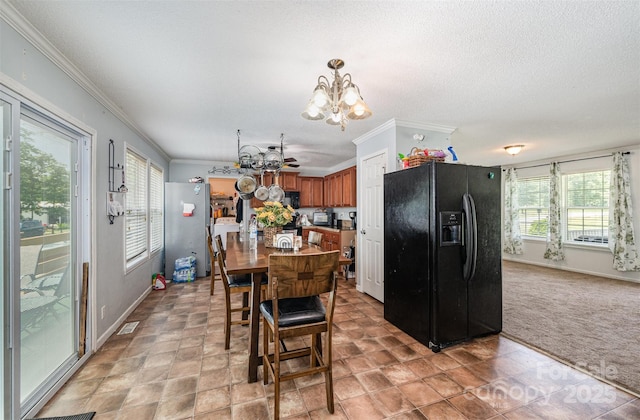 5602 Flint Ridge Church Rd, Marshville, NC 28103 - dining area with a chandelier, ornamental molding, light carpet, and a textured ceiling