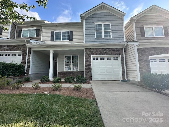 764 River Park Rd, Belmont, NC 28012 - craftsman inspired home with a garage, concrete driveway, covered porch, and stone siding