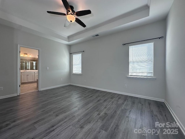 764 River Park Rd, Belmont, NC 28012 - unfurnished room with a raised ceiling, ornamental molding, ceiling fan, and dark wood-style flooring