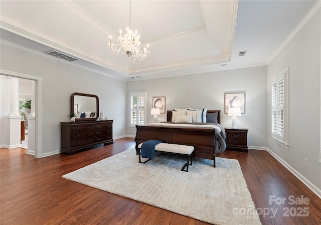 3015 Stanbury Dr, Matthews, NC 28104 - bedroom featuring a chandelier, dark wood-style floors, a tray ceiling, and ornamental molding