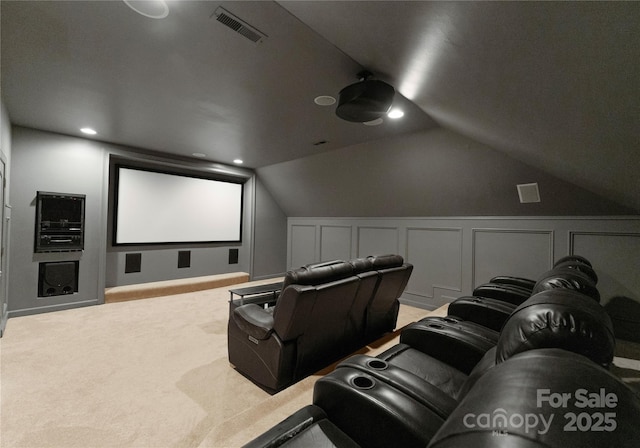 3015 Stanbury Dr, Matthews, NC 28104 - home theater room with carpet, vaulted ceiling, wainscoting, and a decorative wall