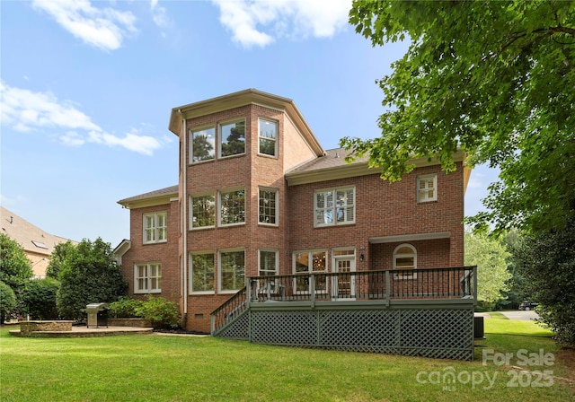 3015 Stanbury Dr, Matthews, NC 28104 - rear view of house with a deck, brick siding, and a yard