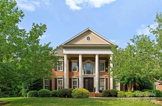 3015 Stanbury Dr, Matthews, NC 28104 - greek revival inspired property with brick siding and a front yard