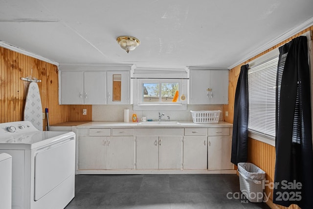 74 Meadow Ave, Concord, NC 28025 - washroom featuring independent washer and dryer, cabinet space, and wooden walls