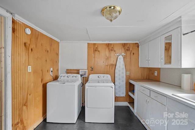 74 Meadow Ave, Concord, NC 28025 - washroom with cabinet space, washer and clothes dryer, ornamental molding, and wood walls