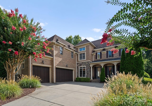 202 Montrose Dr, Waxhaw, NC 28173 - view of front of home with concrete driveway, brick siding, a garage, and an attached garage