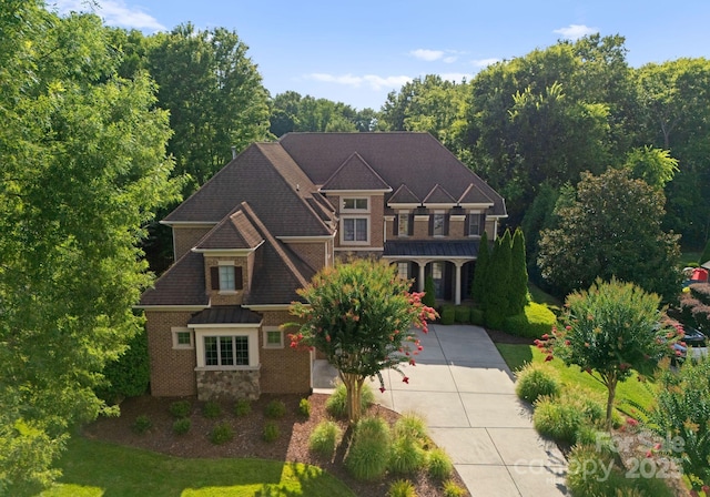 202 Montrose Dr, Waxhaw, NC 28173 - view of front of home featuring a front yard, driveway, and stone siding
