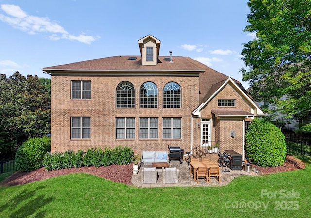 202 Montrose Dr, Waxhaw, NC 28173 - back of property featuring brick siding, an outdoor living space, and a patio