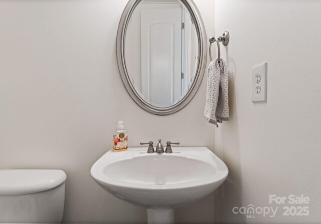 202 Montrose Dr, Waxhaw, NC 28173 - bathroom featuring toilet and a sink