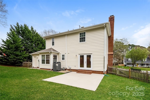 8749 Rittenhouse Cir, Charlotte, NC 28270 - back of property with a chimney, french doors, a patio, and entry steps
