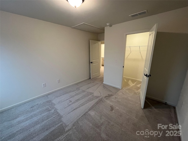 435 Lancashire Ct, Denver, NC 28037 - unfurnished bedroom with light colored carpet, attic access, and a spacious closet