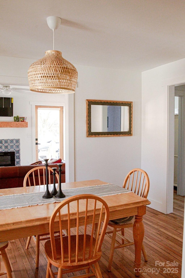 355 Walnut Ave, Spruce Pine, NC 28777 - dining space with wood finished floors and a fireplace