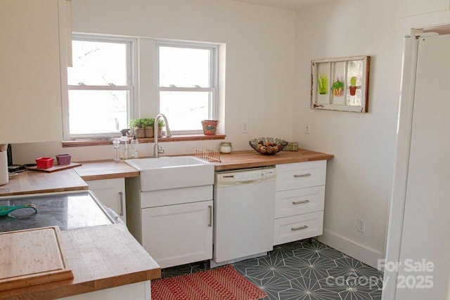355 Walnut Ave, Spruce Pine, NC 28777 - kitchen with dishwasher, white cabinets, and plenty of natural light