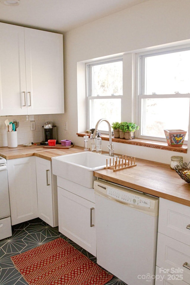 355 Walnut Ave, Spruce Pine, NC 28777 - kitchen with dishwasher, white cabinetry, backsplash, and wood counters