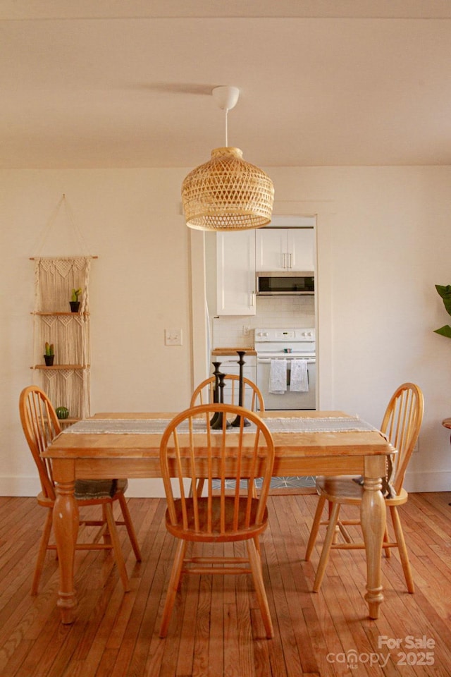 355 Walnut Ave, Spruce Pine, NC 28777 - dining area with light wood-style flooring and baseboards