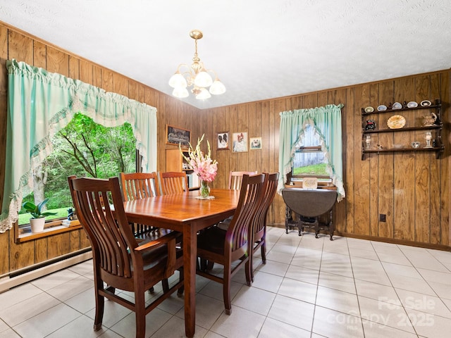 1400 Watershed Rd, Mars Hill, NC 28754 - dining room with a chandelier, wood walls, and light tile patterned flooring