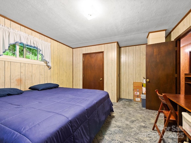 1400 Watershed Rd, Mars Hill, NC 28754 - bedroom featuring wooden walls, a textured ceiling, carpet floors, and crown molding