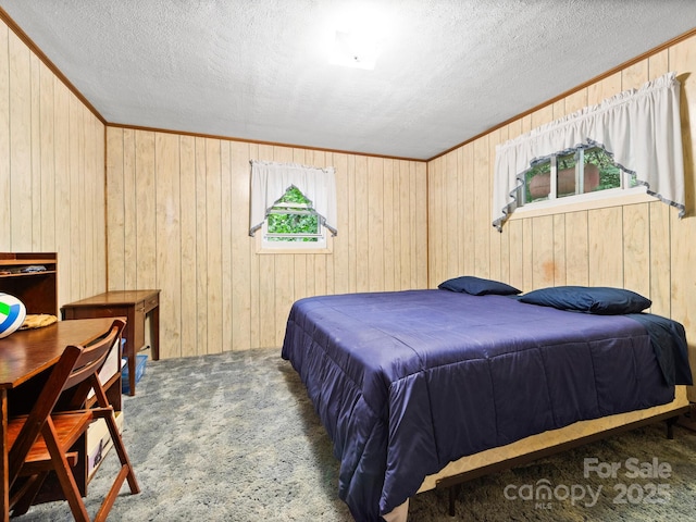 1400 Watershed Rd, Mars Hill, NC 28754 - carpeted bedroom featuring a textured ceiling, wood walls, and crown molding