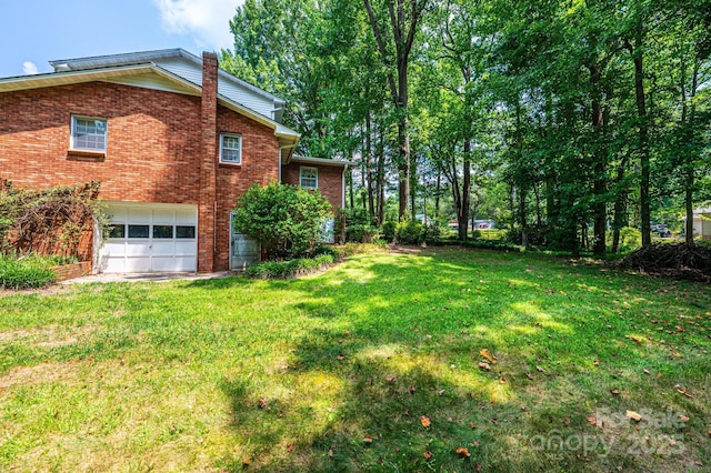 3781 Dover St, Claremont, NC 28610 - view of grassy yard featuring a garage