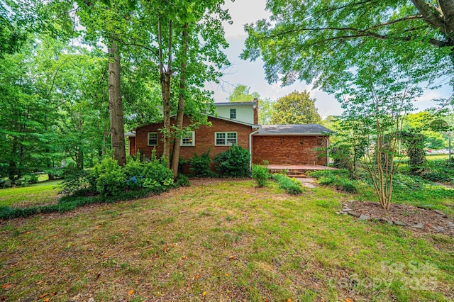 3781 Dover St, Claremont, NC 28610 - view of green lawn featuring a deck