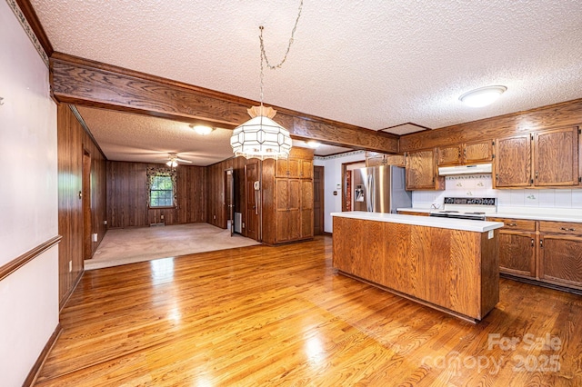 3781 Dover St, Claremont, NC 28610 - kitchen featuring stainless steel refrigerator with ice dispenser, under cabinet range hood, electric stove, a textured ceiling, and light wood-style flooring
