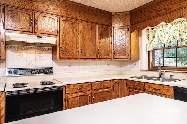 3781 Dover St, Claremont, NC 28610 - kitchen featuring white electric range oven, under cabinet range hood, light countertops, decorative backsplash, and a textured ceiling